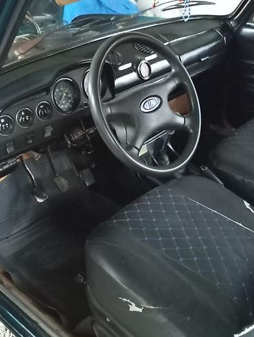 vaz on susə: VAZ 2106, mavi rəng. Klassik sedan kuzov, xrom bamperlər və dördgöz ön — 4