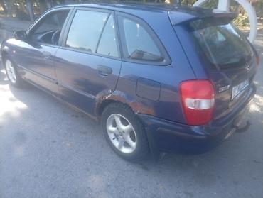 аудио касета: Mazda 323: 2000 г., Механика, Бензин — 2