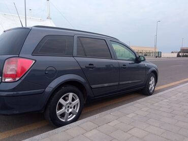 Opel: Opel Astra H – 5 qapılı hetçbek Xüsusiyyətlər: - Kuzov: tünd göy — 15