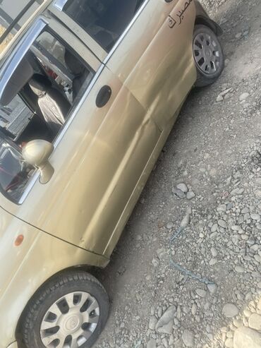 рассрочку автомобил: Автомобиль Daewoo Matiz золотистого цвета, компактный и экономичный
