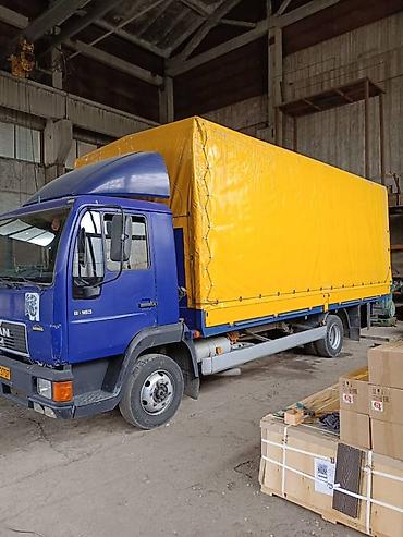 man tg: Бортовой тентованный грузовик MAN с аэродинамическим козырьком. Год — 1
