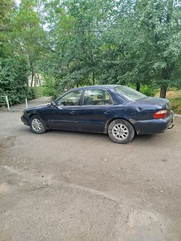 100000 сомдук машиналар: Kia K: 1998 г., 1.8 л, Механика, Бензин, Седан
