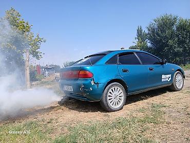 cx 9: Mazda Lantis: 1995 г., 1.5 л, Механика, Бензин, Хэтчбэк — 2