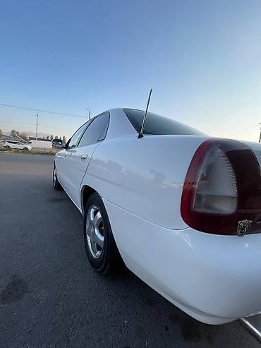 Транспорт: Daewoo Nubira: 1997 г., Бензин, Седан — 5