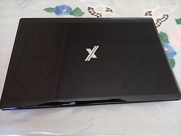 macbook pro 17: Noutbuk – qara, parlaq korpus, üzərində “X” loqosu. Xüsusiyyətlər: - — 1