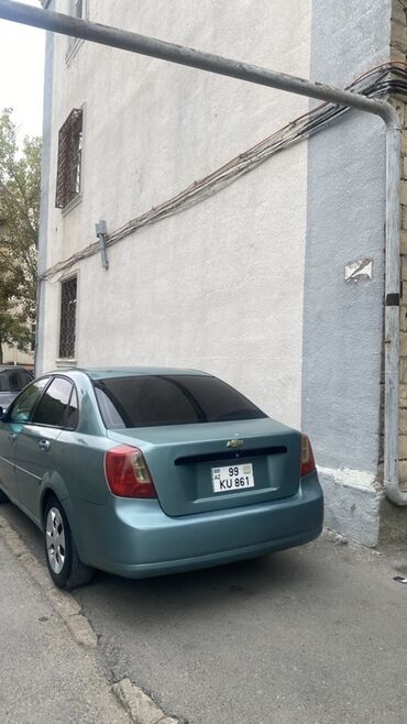 Chevrolet: Chevrolet Lacetti: 1.6 l | 2004 il Sedan — 11