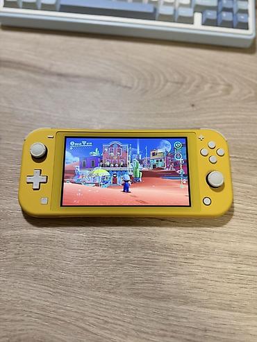nintendo switch lite ikinci el: Nintendo Switch Lite oyun konsolu, ideal veziyyetdedir, seliqeli — 2