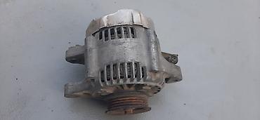man sat: Toyota vitz 1998. 2004 üçün generator (alternator). Şəkildə — 2