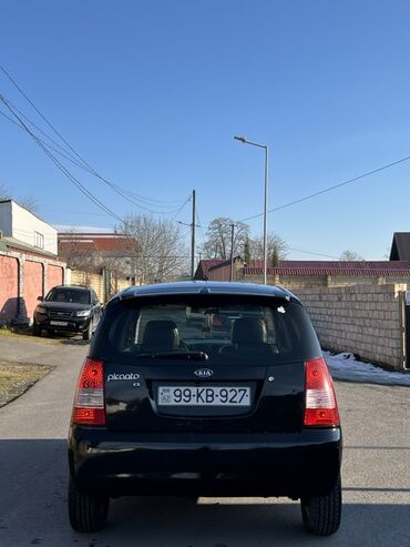 Kia: Kia Picanto EX, qara rəng, 5 qapılı hetçbek. Xüsusiyyətlər: - Kompakt — 4