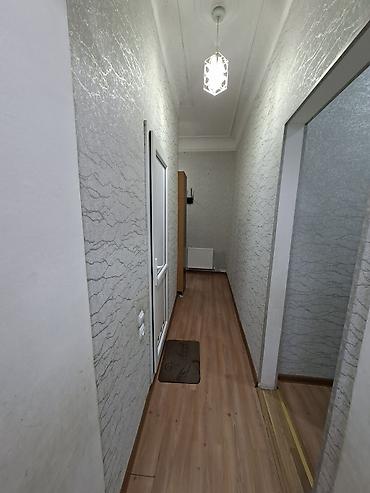 bakıda kreditle evler: 2 mərtəbəli binanın 1ci mərtəbəsi,qanuni 2 otaqlı,43kv+27kv artırma — 3