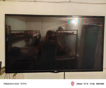 плоский телевизор купить: Телевизор LG с плоским экраном черного цвета. Модель оснащена тонкой