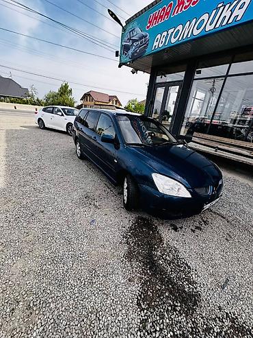 климат одиссей: Mitsubishi Lancer: 2004 г., 1.6 л, Типтроник, Бензин, Универсал — 1