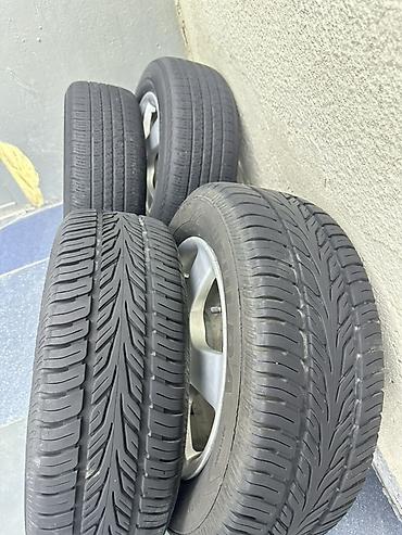 r15 100 4: Комплект из 4 колес в сборе: литые диски + шины. - Диски — 4