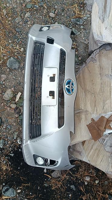 Передний бампер Toyota Aqua (Prius C) дорестайлинг 2012–2014 с