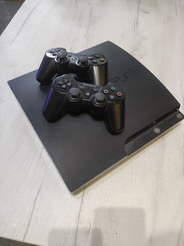 decje igrice: Sony PlayStation 3 slim 160GB + dva dzojstika i desetak igrica medju