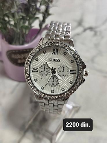 cena ove torbe: GUESS ženski ručni sat – elegantan model u srebrnoj boji. - Kućište — 1