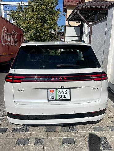 byd e6: AION i60, белый пред макс комплектация с темно серым салоном в — 4