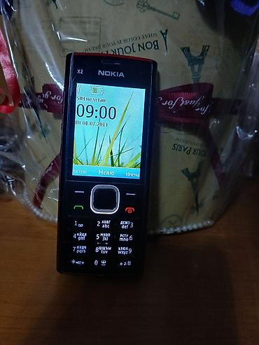 nokia 1: Кнопочный телефон Nokia X2-00 Подходит для звонков, сообщений, музыки — 1