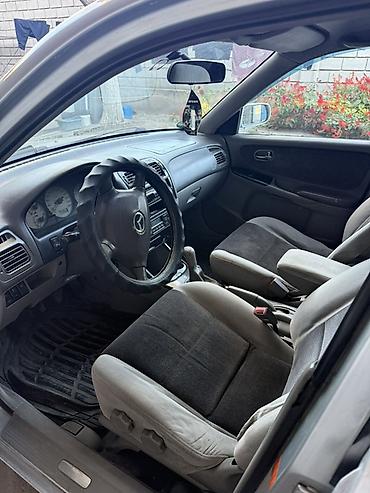 q 7: Mazda 626: 2001 г., 2 л, Механика, Бензин, Универсал — 8