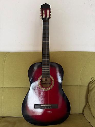 Gitara satılır tam işləkdir simləri yerindədi,cexoluda var.Qiymət