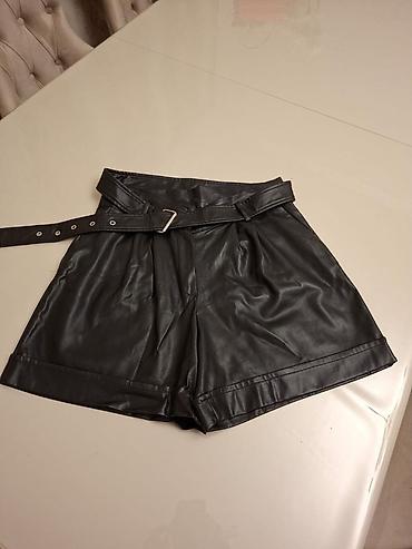 Qara rəngdə, yüksək bel kəsimli eko‑dəri şort. - Material: yumşaq lalafo.az -da Qara rəngdə, yüksək bel kəsimli eko‑dəri şort. - Material: yumşaq