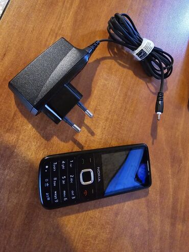 Perodua: Nokia 6700 Slide, rəng - Qara, Düyməli