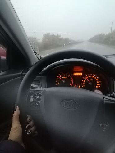 Kia: Kia Pride: 1.5 l | 2006 il Sedan — 8