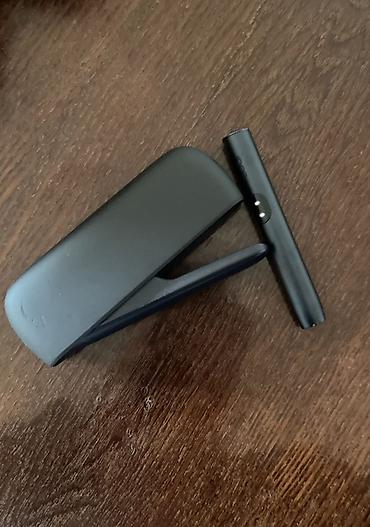 qara halile: IQOS elektron tütün qızdırıcısı, qara rəngdə, kompakt və zərif dizayna — 1