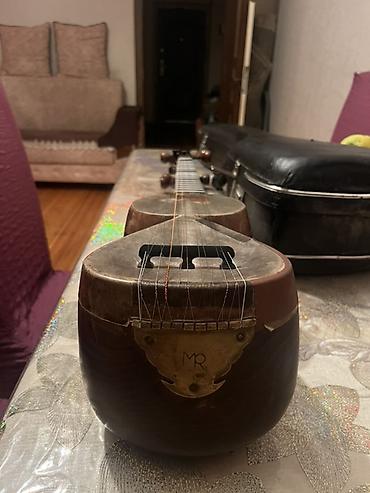 gitara satilir: Tar – milli simli musiqi aləti, sərt futlyarla Xüsusiyyətlər: - — 3