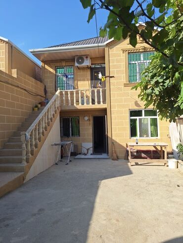 Куплю дом: A two-story residential house featuring a light-colored brick exterior