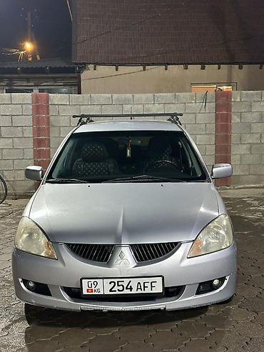авто стенд: Mitsubishi Lancer: 2004 г., 1.6 л, Механика, Бензин, Универсал — 2