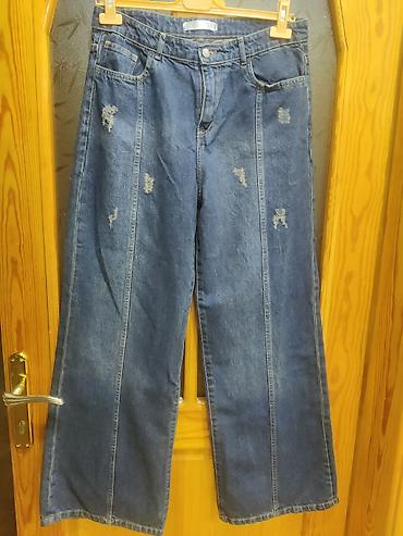 cins şalvar qadin: Geniş kəsimli qadın cins şalvar - Kəsim: wide-leg/straight, ayaqlarda — 1