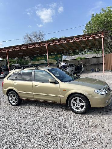 Mazda: Mazda 323: 2003 г., Бензин — 4