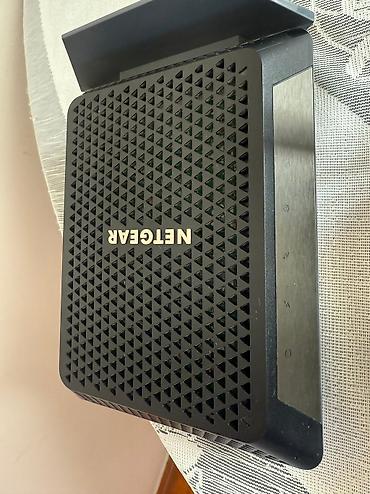 tp link 2 antenli modem: NETGEAR Cable Modem CM700 və NETGEAR Nighthawk R6020 AC750 Mbps 4 Port — 2