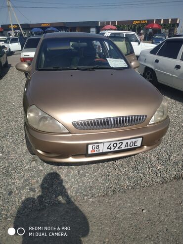 авто в рассрочку без первоначального взноса: Автомобиль Kia Rio бронзового цвета. Компактный кузов, идеально