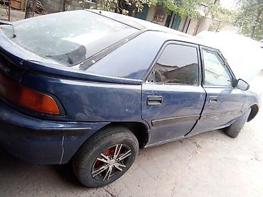 Скупка авто: Mazda 323F, хэтчбек 5 дв., темно‑синий цвет, на разбор. - Кузов: 323F — 2