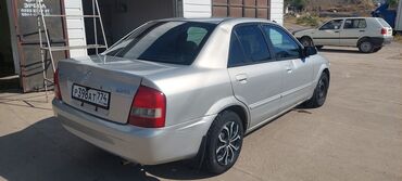 мазда 626: Mazda Familia: 2002 г., 1.5 л, Автомат, Бензин, Седан