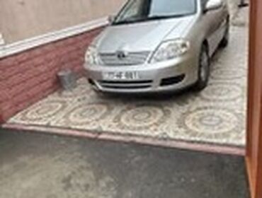 Toyota Corolla: 1.4 л | 2006 г. Седан
