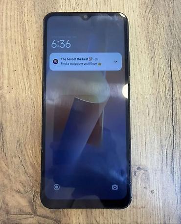 planşetlər və qiymətləri: Smartfon – damla tipli ön kamera çıxıntısı olan, geniş ekranlı model — 1