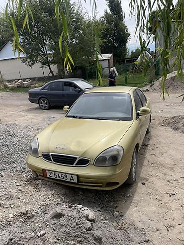 дэу матиз 1: Daewoo Nubira: 1999 г., 1.5 л, Кол менен иштөөчү, Бензин, Седан — 1