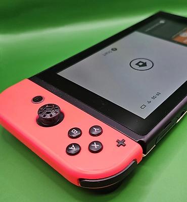 Nintendo Switch: Игровая консоль Nintendo Switch с разноцветными Joy‑Con (левый — — 7