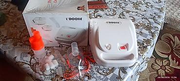 tibb geyimi: L’DOCILE inhalyator/nebulayzer cihazı. Komplektdə görünən hissələr: - — 2