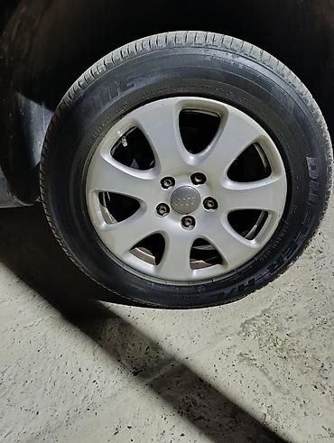 maşin tekerleri: Audi orijinal yüngül lehimli disklər və Bridgestone Dueler H/L — 4