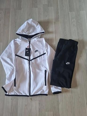 Gornji i donji deo: Ženska Nike trenerka – jakna sa kapuljačom + donji deo - Model — 6