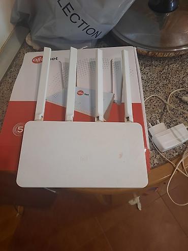 Xiaomi Mi Wi‑Fi Router (4 antennali) - Brend: Xiaomi (Mi loqolu