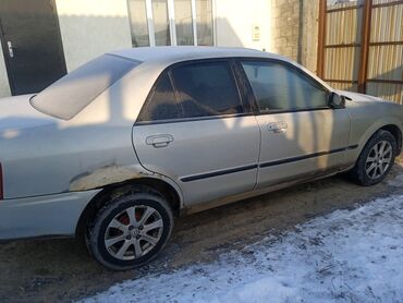 Mazda: Mazda 323: 1999 г., 1.6 л, Автомат, Бензин, Седан