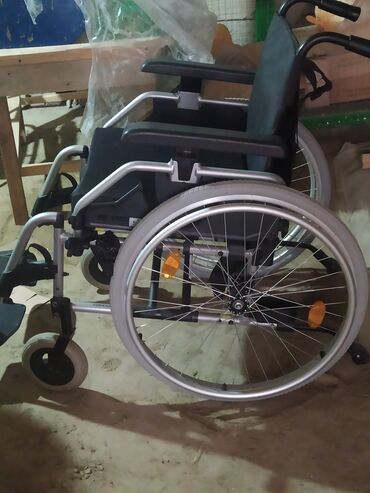 əlil arabası: Инвалидные коляски