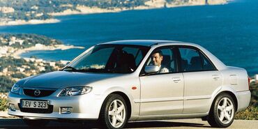 duks za menjač: Mazda 323: 2 l | 2001 г. Limuzina