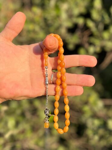 Təsbehlər: Orjinal sıxma kəhrəba.tünd sarı rəngli badami kəsim.günlük çəkim üçün
