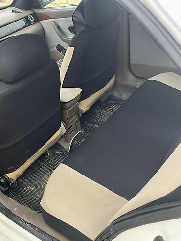 Digər avtomobillər: Satılır: Ağ rəngli sedan Texniki xüsusiyyətlər və detallı təsvir: - — 5